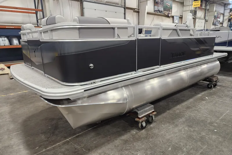 The Image of 2026 Tahoe Pontoon Sport Rear Fish 17 in a showroom, showcasing sleek design and modern features. - 0