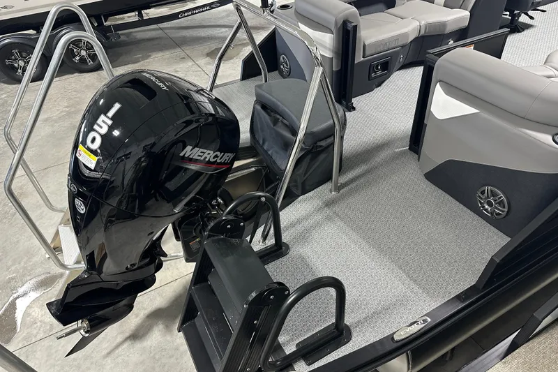 Slide: The Image of Evotti 521QL 2026 boat with Mercury 150 outboard motor, interior seating, and ladder. - 2