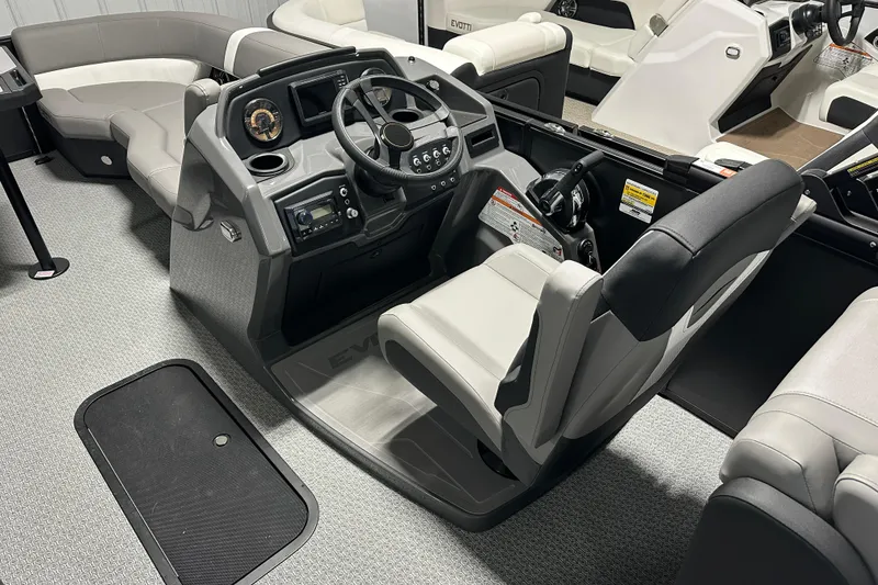 Slide: The Image of Interior of 2026 Evotti 521QL boat with modern steering console and seating. - 4