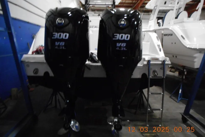 Slide: The Image of 2023 Sea Fox 288 Commander with twin 300 V6 4.2L engines in a workshop. - 22