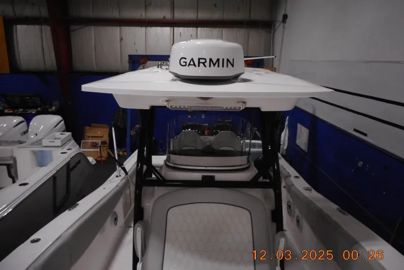 Slide: The Image of 2023 Sea Fox 288 Commander boat with Garmin radar in a warehouse setting. - 24