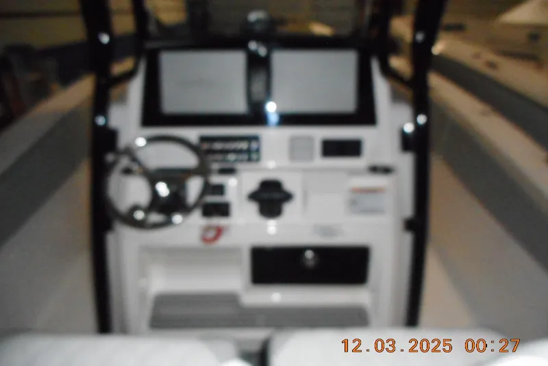 Slide: The Image of Blurry interior view of 2023 Sea Fox 288 Commander boat dashboard and controls. - 26