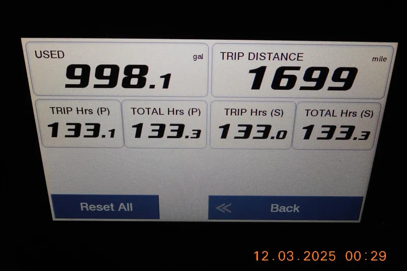 Slide: The Image of Display screen showing Sea Fox 288 Commander trip data: 998.1 gallons used, 1699 miles traveled. - 31