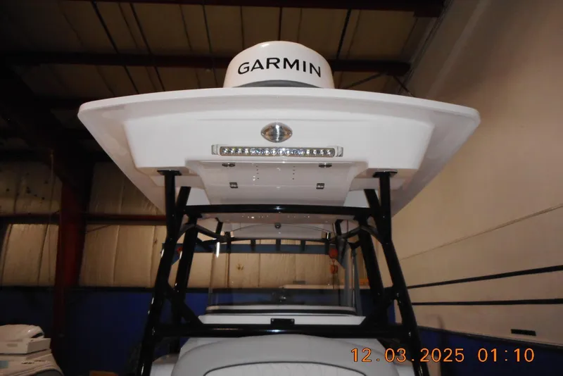 Slide: The Image of 2023 Sea Fox 288 Commander boat with Garmin equipment in a warehouse setting. - 33