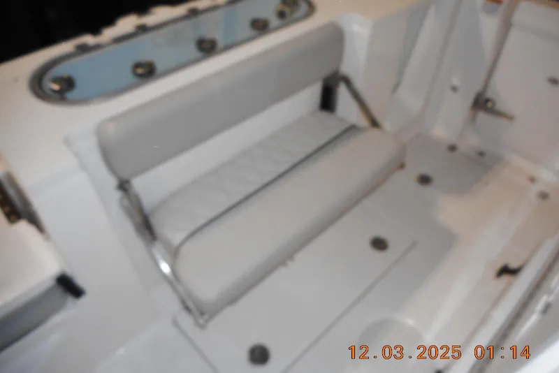 Slide: The Image of 2023 Sea Fox 288 Commander boat interior with cushioned seating and storage area. - 40