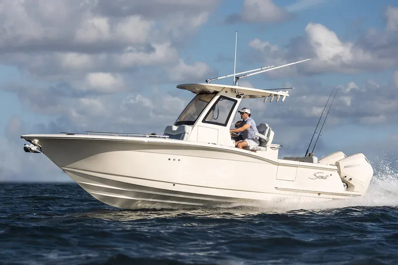 The Image of Manufacturer Provided Image: 2025 Scout 260 LXF boat cruising on open water under a cloudy sky. - 0