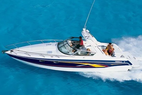 Slide: The Image of 2006 Formula 330 Sun Sport boat propellers and outdrives in a maintenance setting. - 4