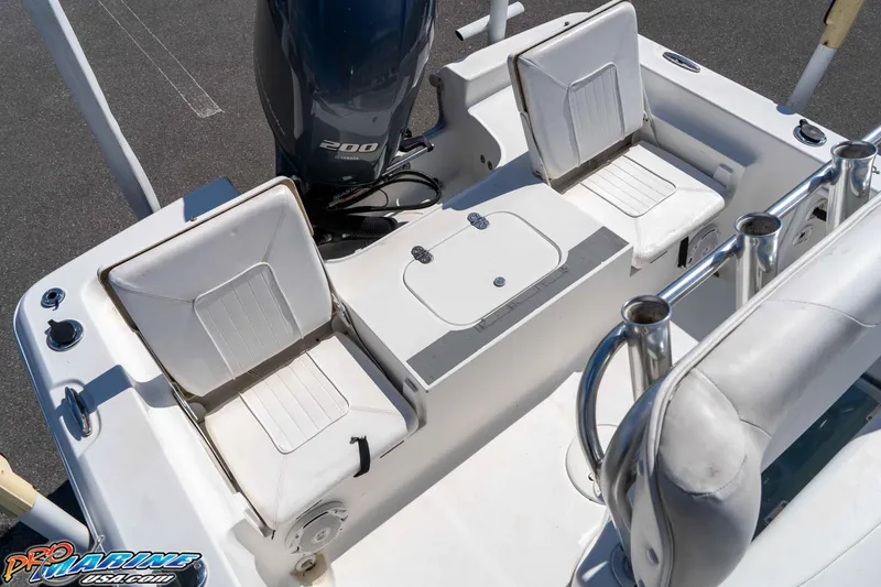 Slide: The Image of 2014 Sea Hunt BX 22 Pro boat interior with Yamaha 200 engine and seating. - 15