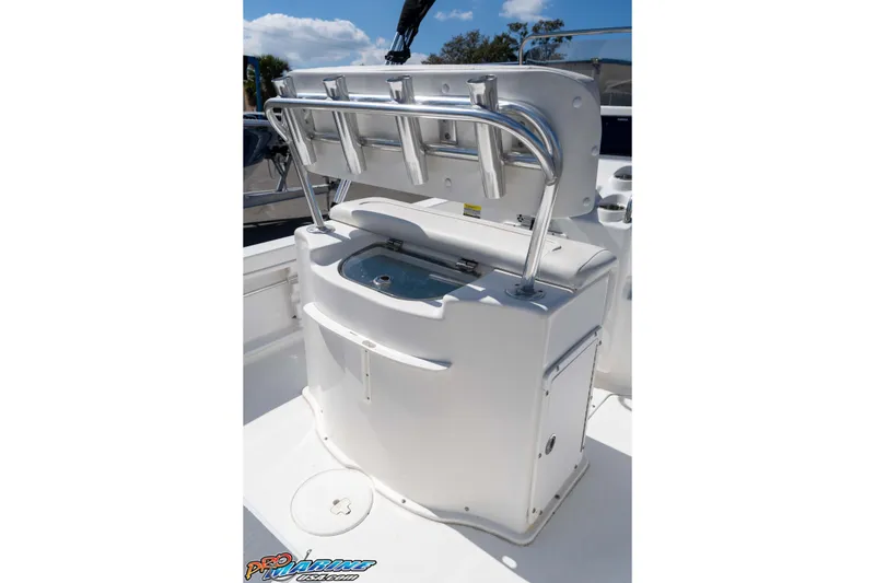 Slide: The Image of 2014 Sea Hunt BX 22 Pro boat console with rod holders and storage. - 16
