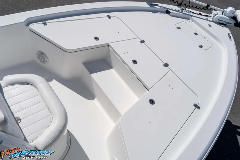 Slide: The Image of 2014 Sea Hunt BX 22 Pro boat deck with storage compartments and seating. - 20