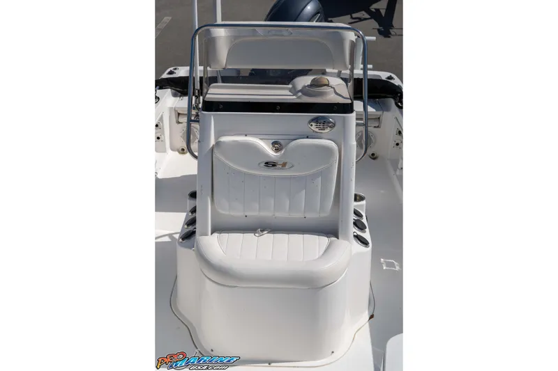Slide: The Image of 2014 Sea Hunt BX 22 Pro boat console with seating and storage. - 22
