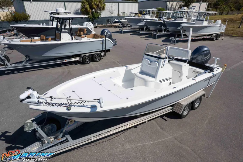 Slide: The Image of 2014 Sea Hunt BX 22 Pro boat on trailer in marina lot. - 25