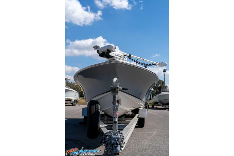 Slide: The Image of 2014 Sea Hunt BX 22 Pro boat on trailer under blue sky. - 3
