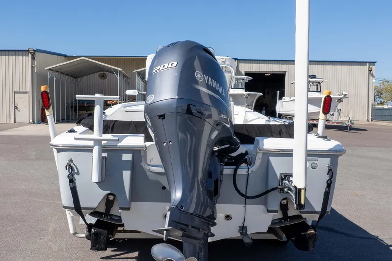 Slide: The Image of 2014 Sea Hunt BX 22 Pro boat with Yamaha 200 engine, parked outdoors. - 30