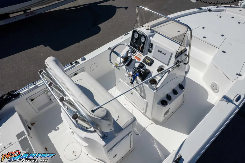 Slide: The Image of 2014 Sea Hunt BX 22 Pro boat interior with steering console and seating. - 45