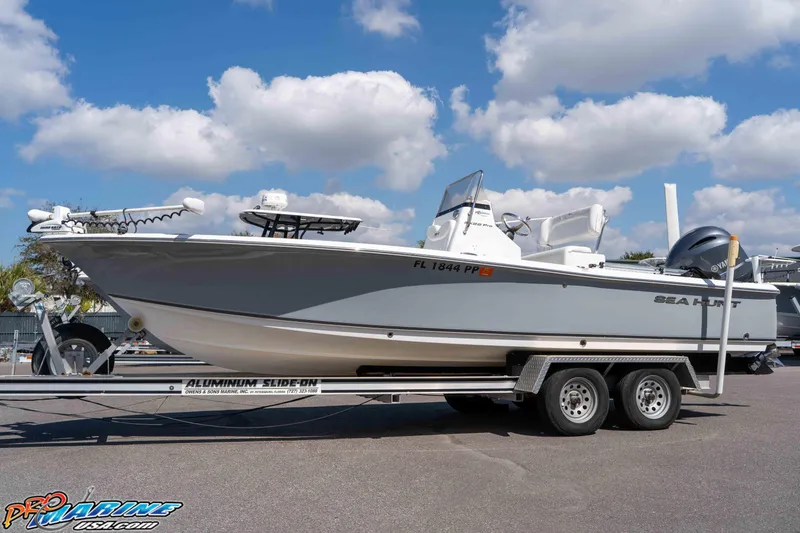 Slide: The Image of 2014 Sea Hunt BX 22 Pro boat on trailer under blue sky. - 8