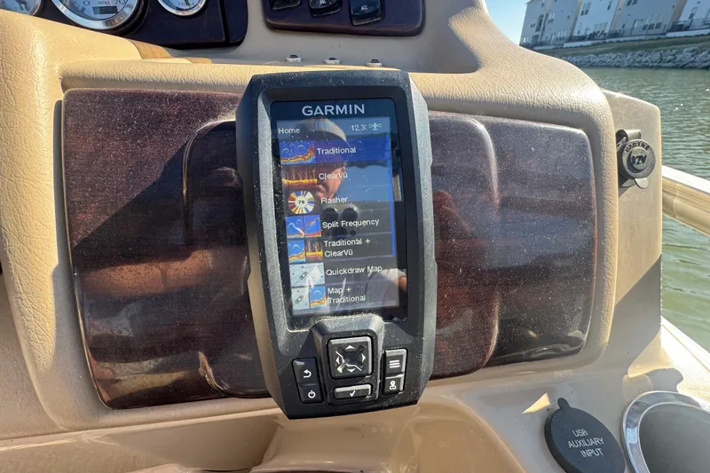 Slide: The Image of Garmin GPS on 2012 Bennington 2275 GFS boat dashboard, displaying navigation options. - 10