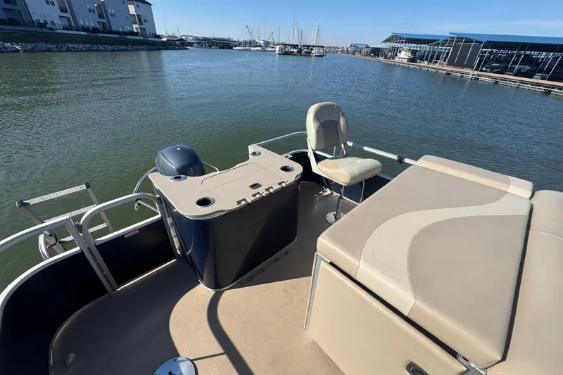 Slide: The Image of 2012 Bennington 2275 GFS pontoon boat on calm water near marina. - 20