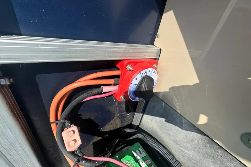 Slide: The Image of Battery switch on a 2012 Bennington 2275 GFS boat with connected cables. - 24