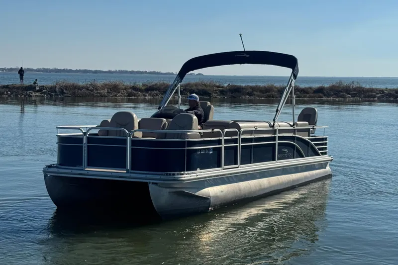 Slide: The Image of 2012 Bennington 2275 GFS pontoon boat on calm water, sunny day. - 5