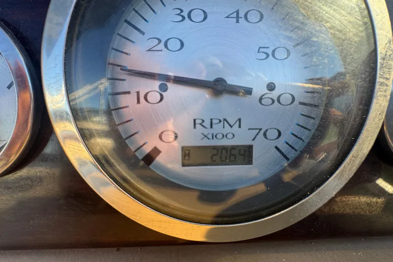 Slide: The Image of Close-up of a 2012 Bennington 2275 GFS RPM gauge showing 2064 hours. - 9