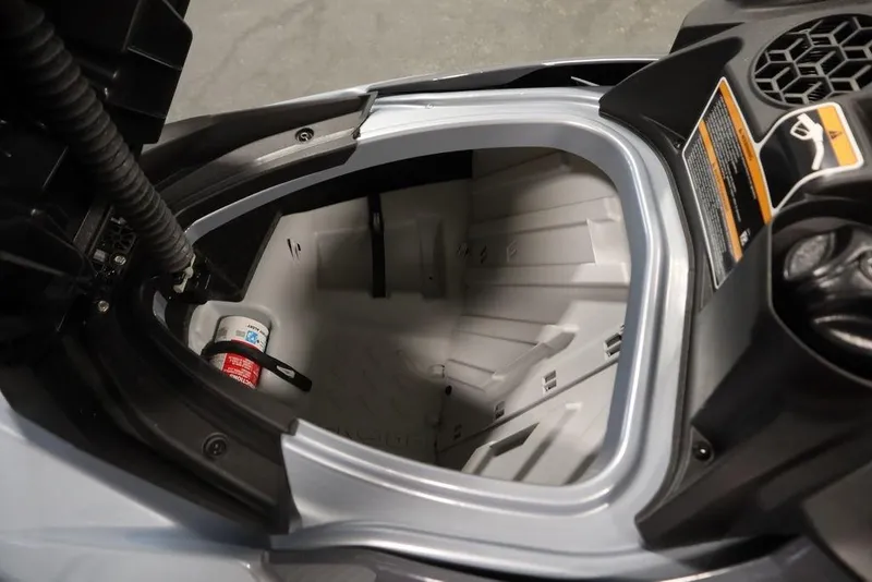 Slide: The Image of 2021 Sea-Doo GTI SE 170 storage compartment with safety equipment inside. - 10