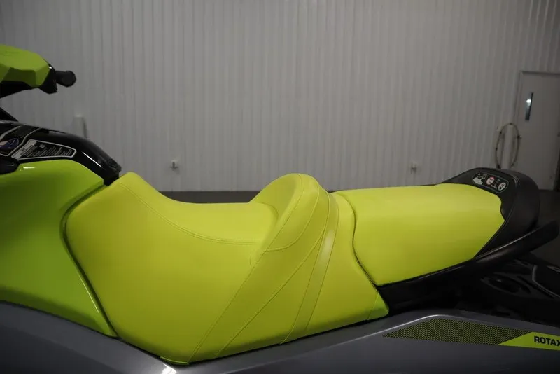Slide: The Image of 2021 Sea-Doo GTI SE 170, lime green seat, side view in a garage. - 17
