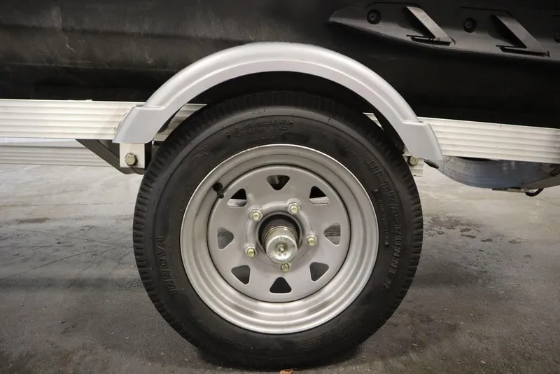 Slide: The Image of Trailer wheel for 2021 Sea-Doo GTI SE 170, featuring a silver rim and black tire. - 24