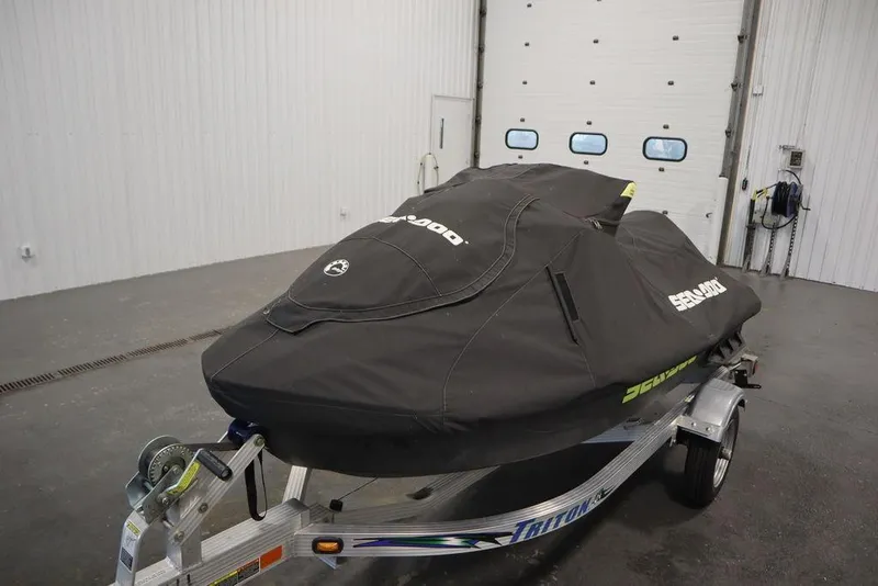 Slide: The Image of 2021 Sea-Doo GTI SE 170 covered on trailer in garage setting. - 25