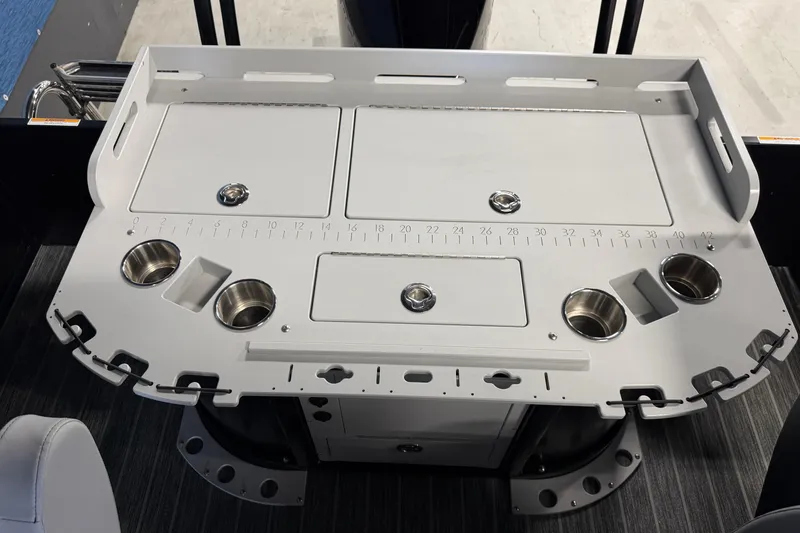 Slide: The Image of Premier 230 Sunsation Angler 2pt 2025 boat console with cup holders and measurement guide. - 17