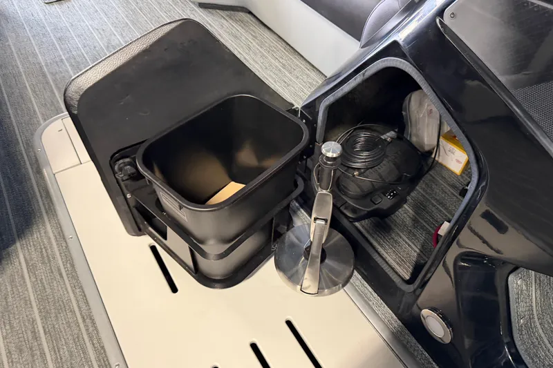 Slide: The Image of Interior storage of 2025 Premier 230 Sunsation Angler 2pt boat with utility compartments. - 19