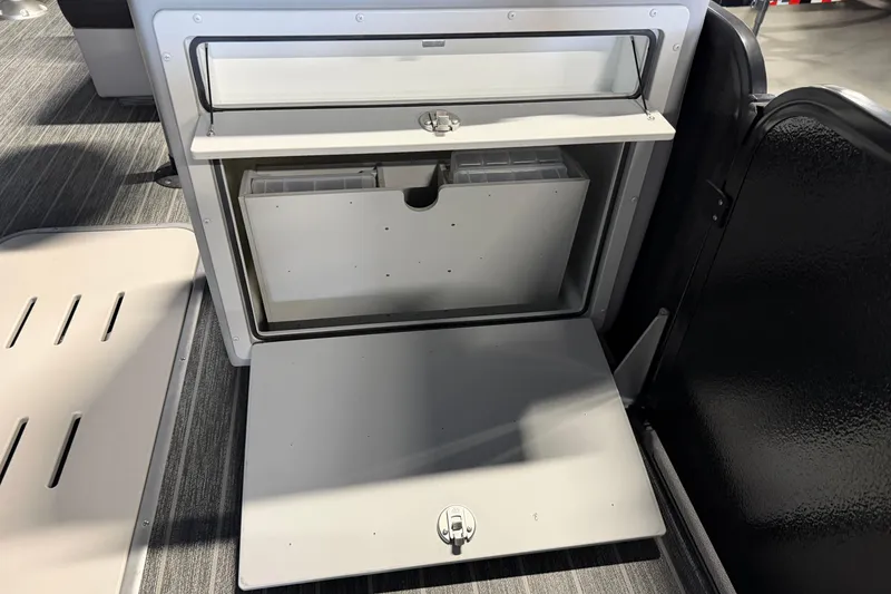 Slide: The Image of Storage compartment on 2025 Premier 230 Sunsation Angler 2pt boat, featuring organized interior space. - 22