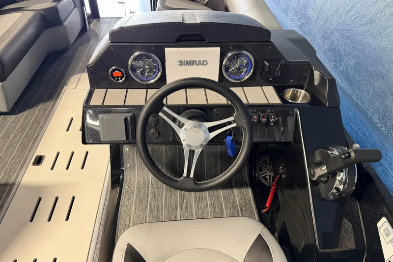 Slide: The Image of 2025 Premier 230 Sunsation Angler 2pt boat dashboard with steering wheel and controls. - 8