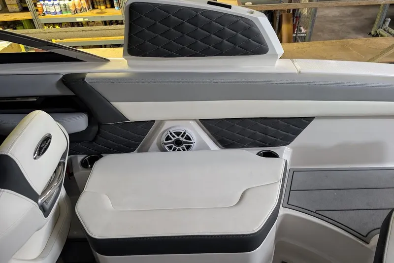 Slide: The Image of 2024 Chaparral 267 SSX interior with quilted upholstery and speaker detail. - 21