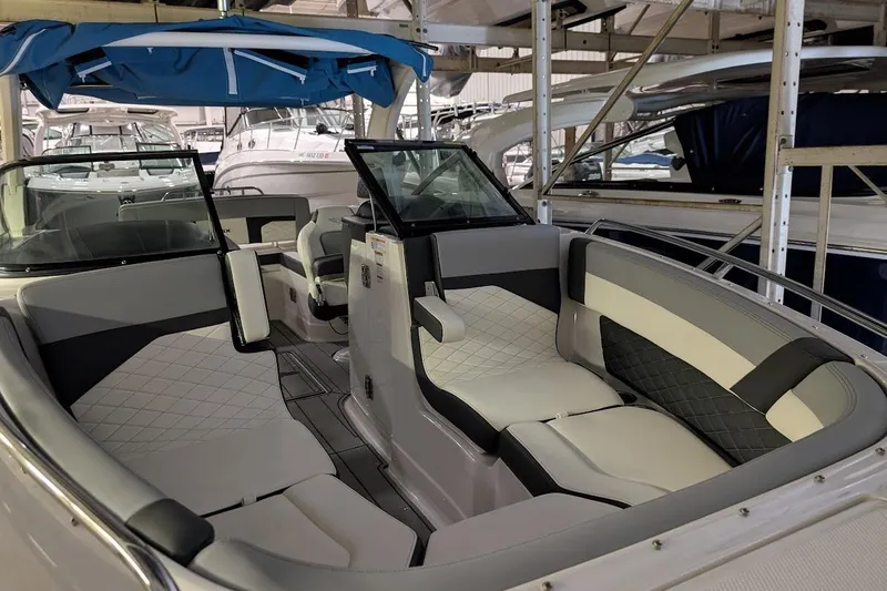 Slide: The Image of 2024 Chaparral 267 SSX boat interior with luxurious seating and modern design. - 25