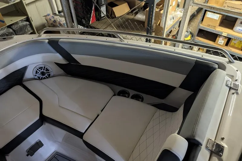 Slide: The Image of 2024 Chaparral 267 SSX boat interior with cushioned seating and speaker system. - 26
