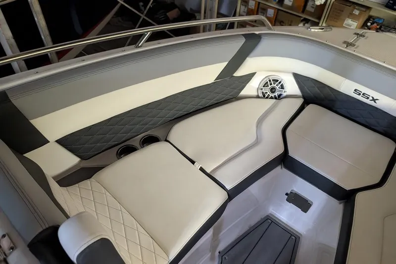 Slide: The Image of 2024 Chaparral 267 SSX boat interior with luxurious seating and speaker system. - 27