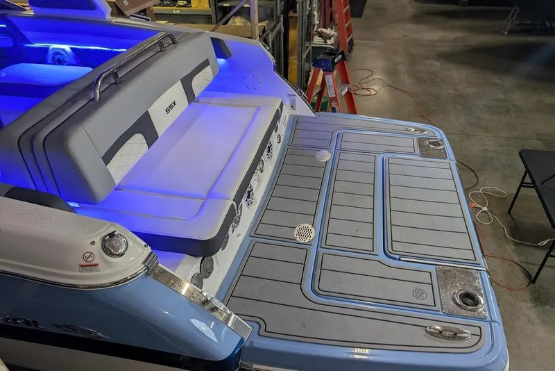 Slide: The Image of 2024 Chaparral 267 SSX boat with illuminated seating and spacious swim platform. - 9