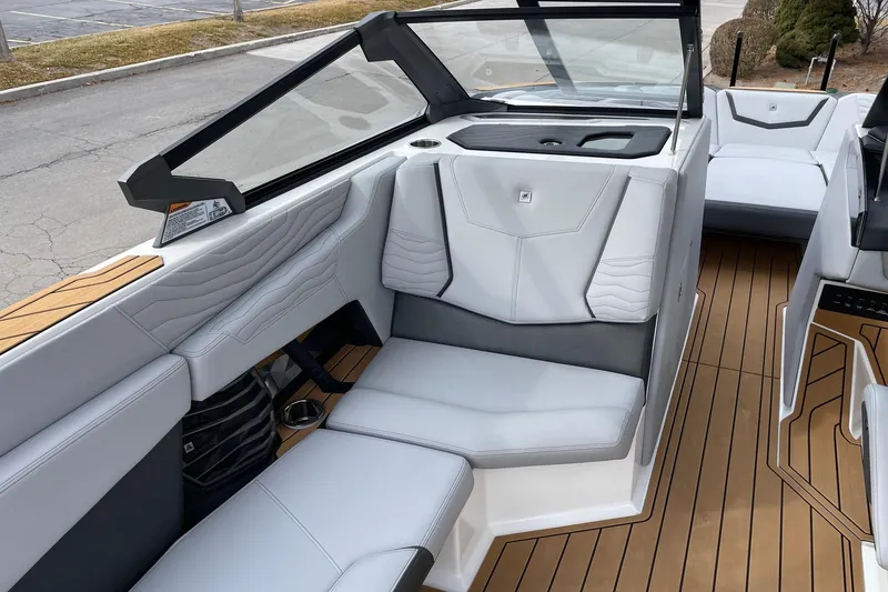 Slide: The Image of 2025 Nautique Super Air Nautique G25 interior with sleek seating and modern design. - 10