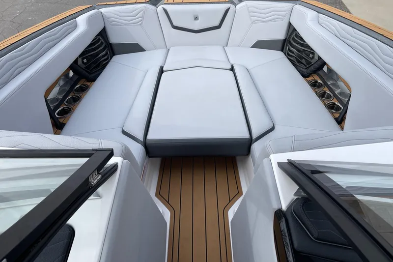 Slide: The Image of Luxurious interior of 2025 Nautique Super Air Nautique G25 boat with plush seating. - 11