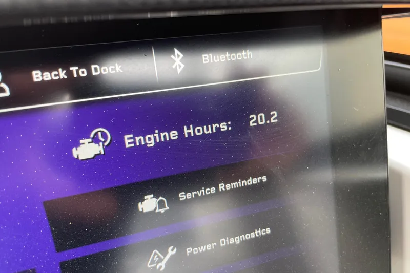 Slide: The Image of Display screen of 2025 Nautique Super Air Nautique G25 showing 20.2 engine hours. - 12