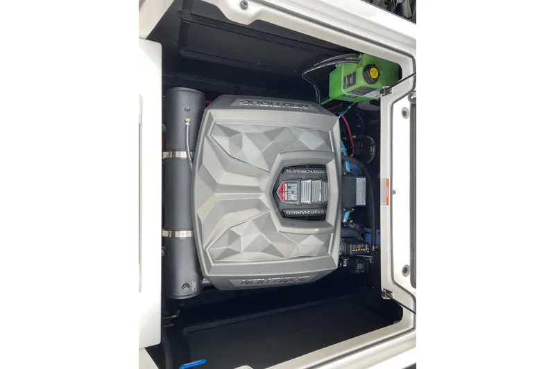 Slide: The Image of 2025 Nautique Super Air Nautique G25 engine compartment showcasing powerful supercharged engine. - 13