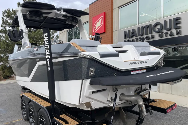 Slide: The Image of 2025 Nautique Super Air Nautique G25 boat displayed at dealership, rear view. - 3