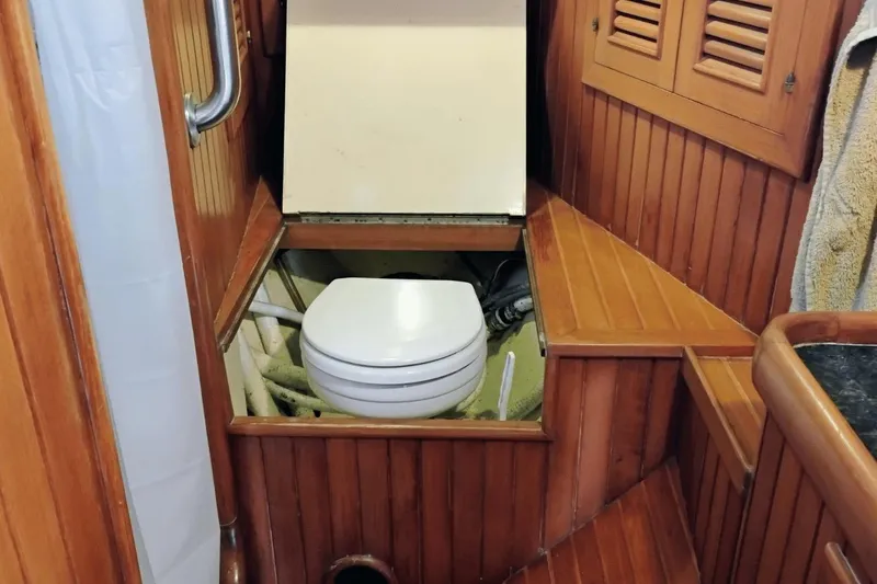 Slide: The Image of Wood-paneled boat bathroom with a hidden toilet, Hans Christian 38, 1985 model. - 21