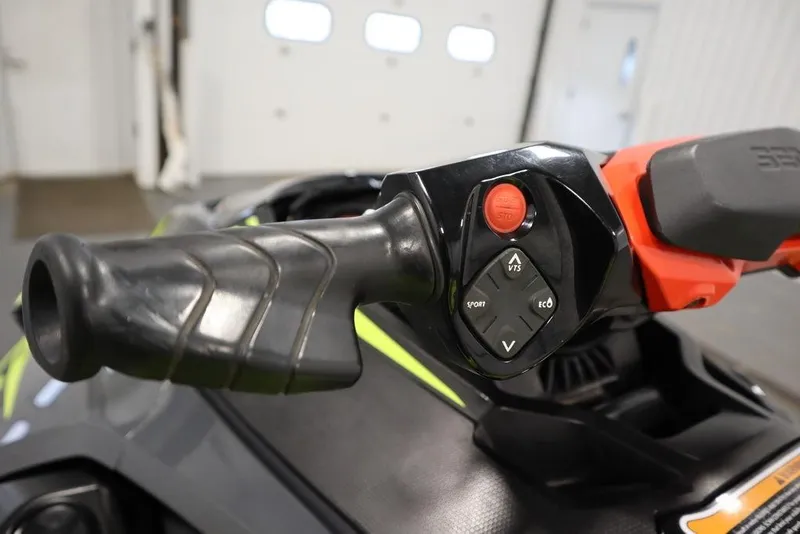 Slide: The Image of Close-up of 2018 Sea-Doo RXT-X 300 handlebar controls in a garage setting. - 10