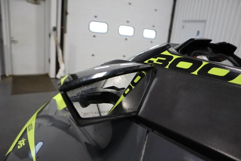 Slide: The Image of 2018 Sea-Doo RXT-X 300 jet ski with vibrant yellow accents in a garage setting. - 11