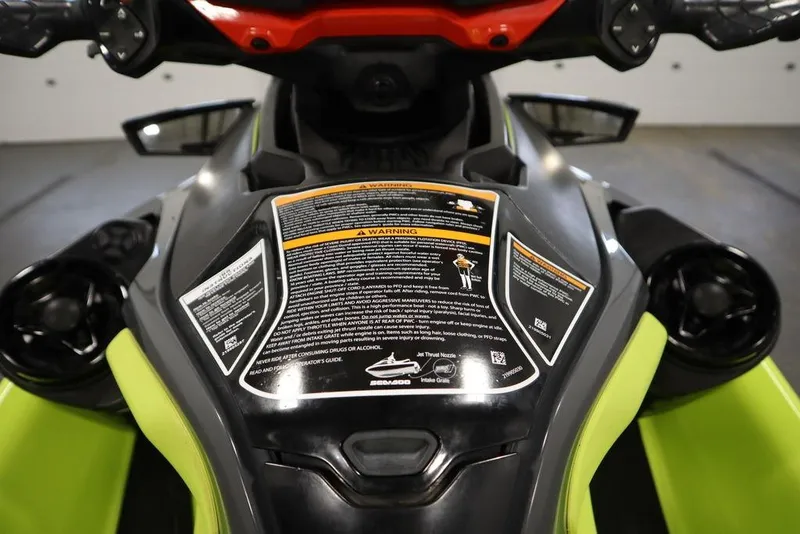 Slide: The Image of 2018 Sea-Doo RXT-X 300 dashboard with warning labels and controls. - 14