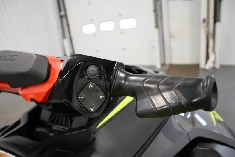 Slide: The Image of 2018 Sea-Doo RXT-X 300 handlebar with control buttons in a garage setting. - 15