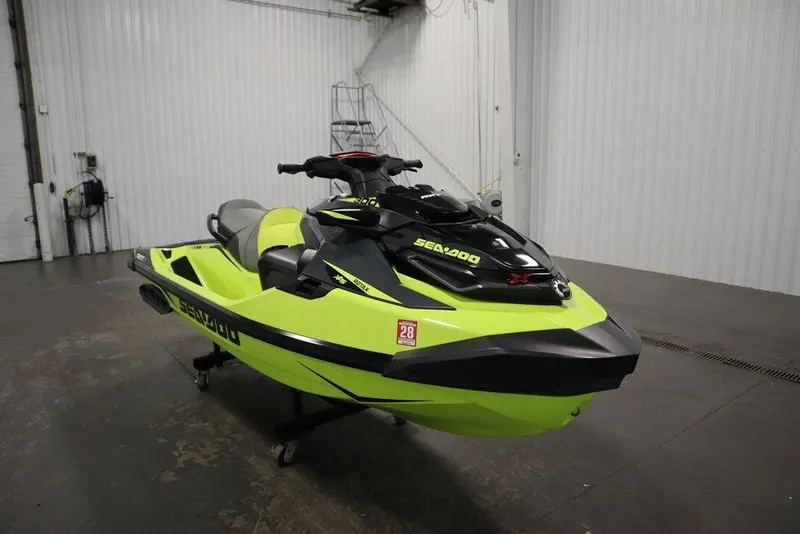 Slide: The Image of 2018 Sea-Doo RXT-X 300 jet ski in a garage, vibrant yellow and black design. - 4