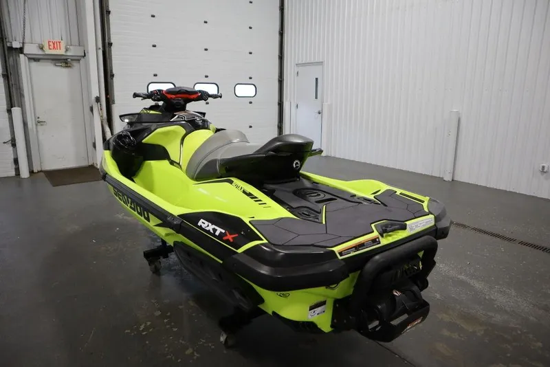 Slide: The Image of 2018 Sea-Doo RXT-X 300 in a garage, vibrant yellow and black design. - 7